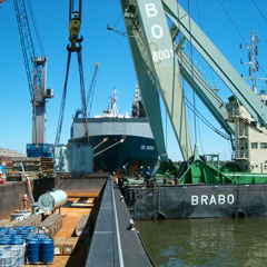 Direct export transhipment of transformer ex barge to seagoing vessel.